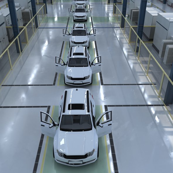 White vehicles on an automotive manufacturing assembly line